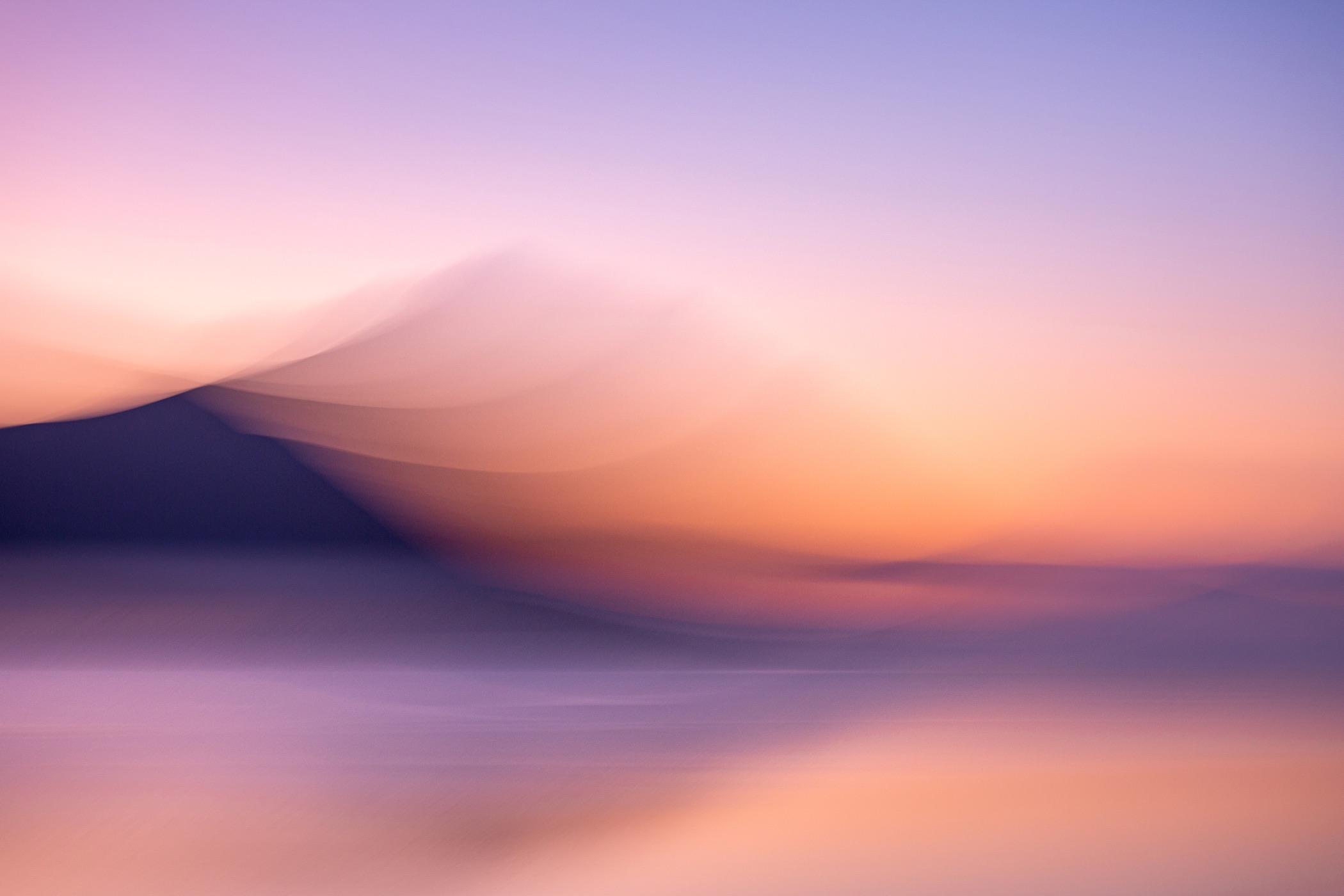 Pastel intentional-camera-movement abstract of a mountain dissolving into a still lake at dusk, New Zealand, by Stephanie Johnson